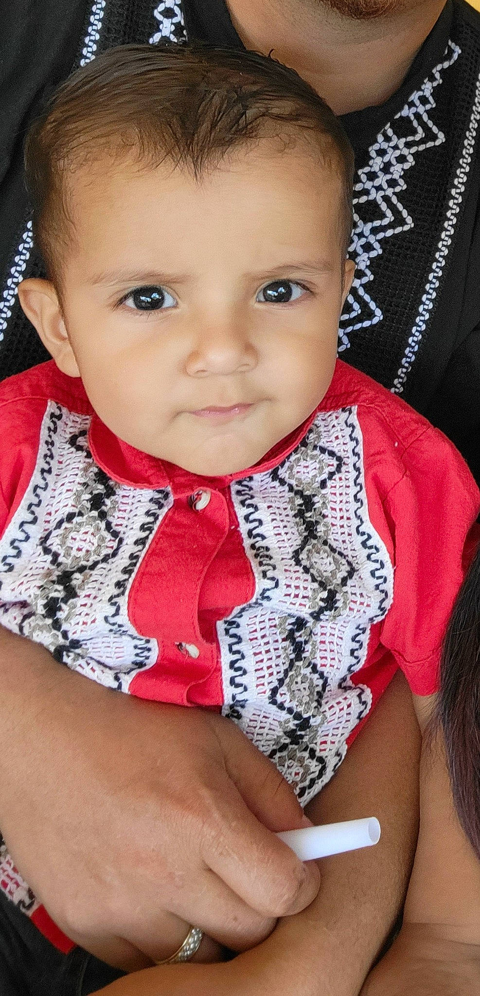 Jose is registered to the contest to win money with this photo: baby, baby_toddler_clothing, cheek, chin, collar, eyebrow, eyelash, facial_expression, finger, happy, iris, lip, mouth, neck, nose, outerwear, person, skin, sleeve, toddler