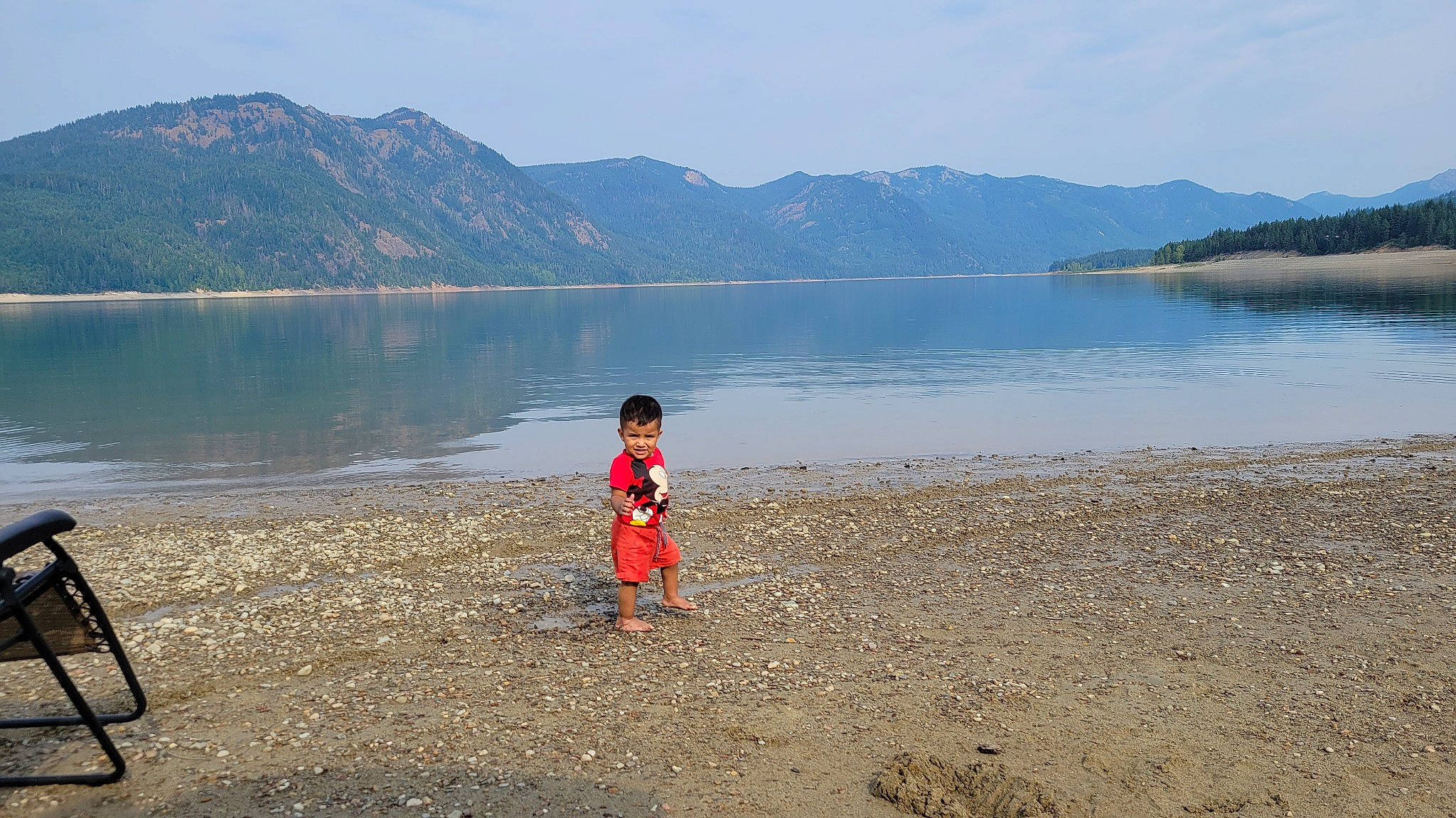 Jose joined the competition — help win amazing prizes! beach, calm, coastal_and_oceanic_landforms, hill, horizon, lacustrine_plain, lake, landscape, leisure, mountain, mountain_range, natural_landscape, people_in_nature, person, recreation, reflection, sand, shore, sky, travel