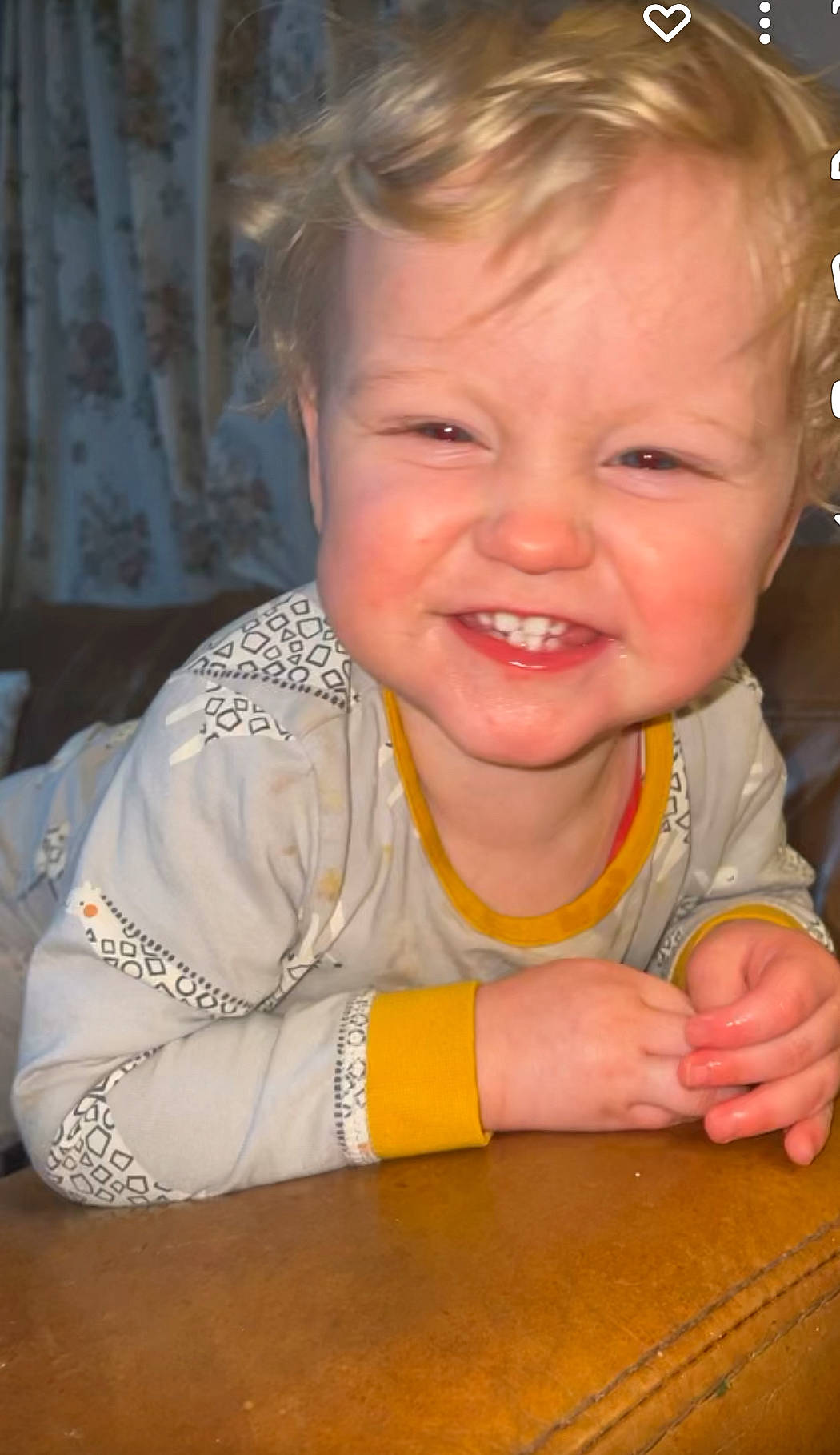 Elijah is registered to the contest to win money with this photo: arm, baby, cheek, child, curtain, event, finger, fun, gesture, happy, iris, joy, lip, nose, person, play, sitting, skin, smile, thumb