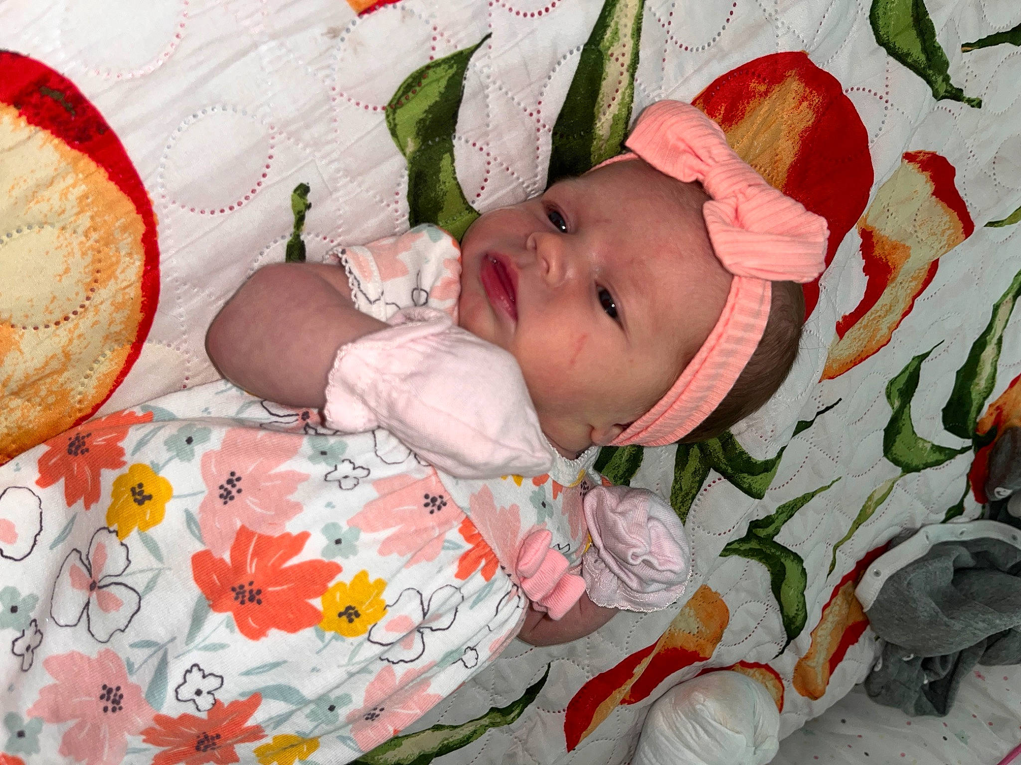 Hayleigh is registered to the contest to win money with this photo: baby, baby_products, baby_sleeping, baby_toddler_clothing, carmine, cheek, child, comfort, eye, happy, headwear, human_body, linens, mouth, pattern, person, petal, pink, room, skin