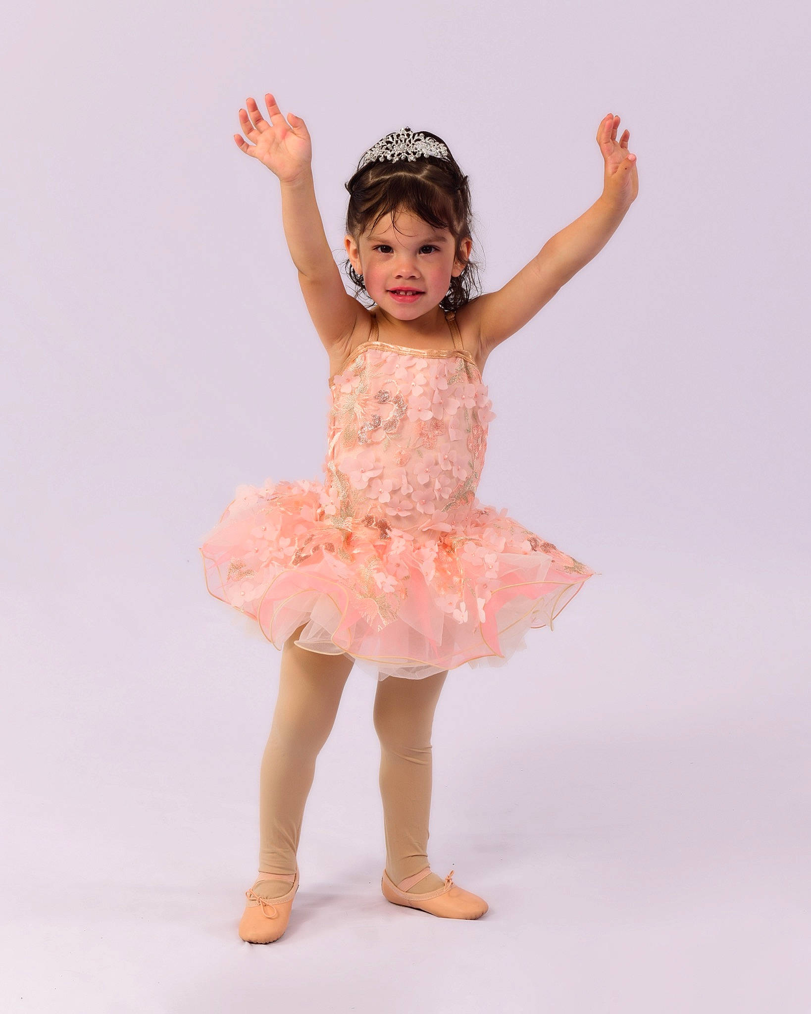 Effie is registered to the contest to win money with this photo: baby_toddler_clothing, barefoot, dance, day_dress, embellishment, entertainment, event, fashion_design, gesture, happy, human_body, human_leg, leg, pattern, performing_arts, person, sleeve, smile, thigh, toddler