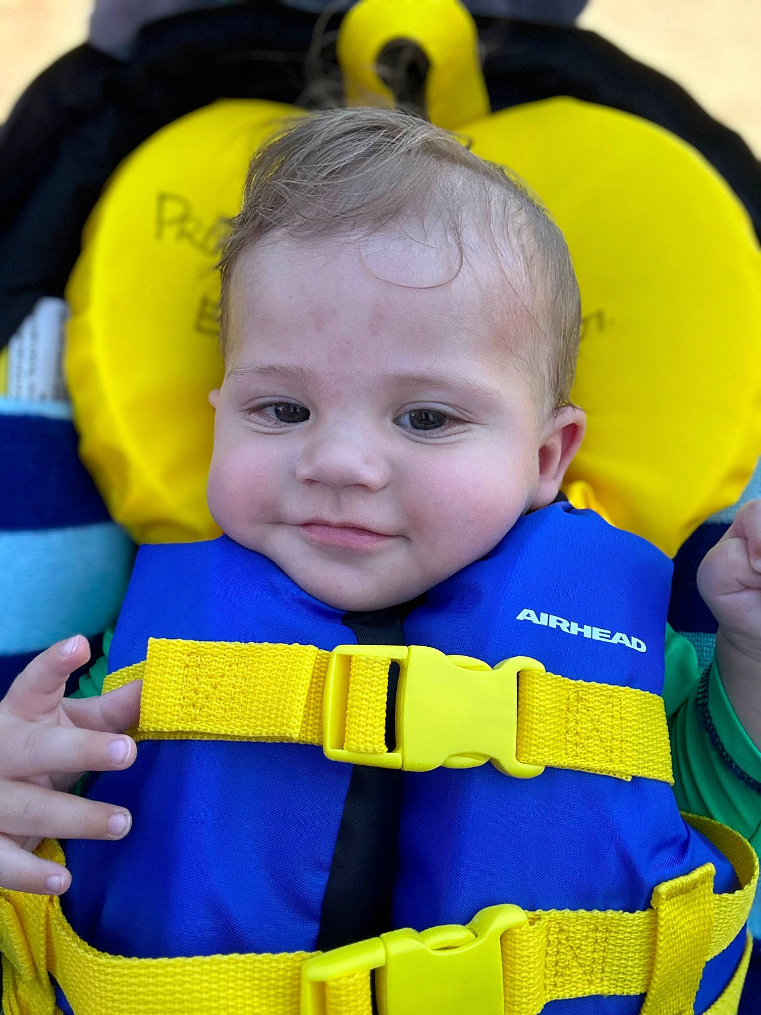 Shane is registered to the contest to win money with this photo: baby, baby_toddler_clothing, cheek, child, electric_blue, facial_expression, fun, hairstyle, happy, head, human, leisure, nose, orange, person, personal_protective_equipment, play, product, toddler, white