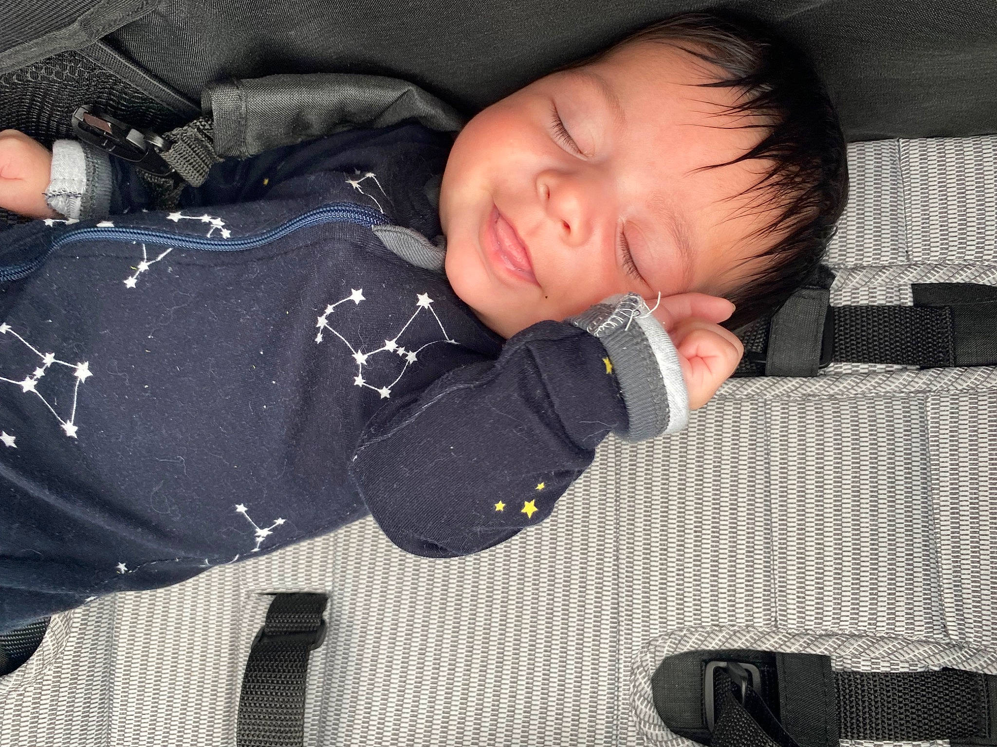 Ezra is registered to the contest to win money with this photo: baby, baby_products, baby_sleeping, baby_toddler_clothing, bag, bedtime, child, comfort, flooring, linens, luggage_and_bags, nap, pattern, person, plaid, portrait_photography, sitting, sleep, sleeve, toddler