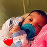 baby, baby_garments, bed, blanket, closeup, clothing, cute, face, hand, indoor, infant, newborn, pacifier, person, portrait, red_heart, resting, sleepy, soft, wrapped