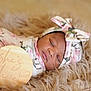 newborn, baby, sleeping, floral, swaddle, headband, wooden_sign, blanket, soft, cute, portrait, infant, peaceful, resting, indoors, closeup, baby_girl, cozy, warm, tender