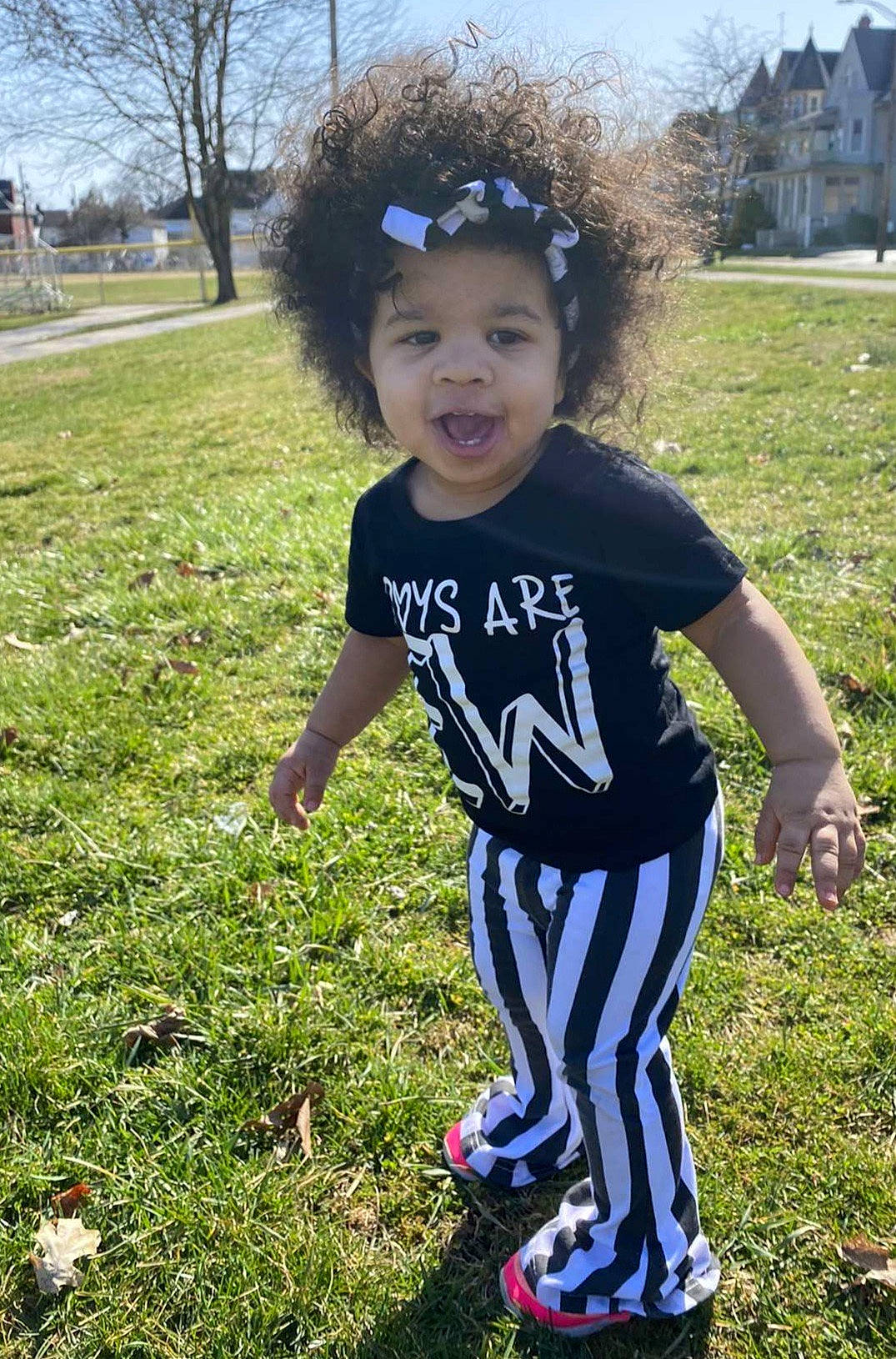 Maliyah is registered to the contest to win money with this photo: baby_toddler_clothing, child, cool, face, fun, grass, happy, head, lawn, leaf, people_in_nature, person, plant, recreation, sky, sleeve, smile, sportswear, t_shirt, toddler