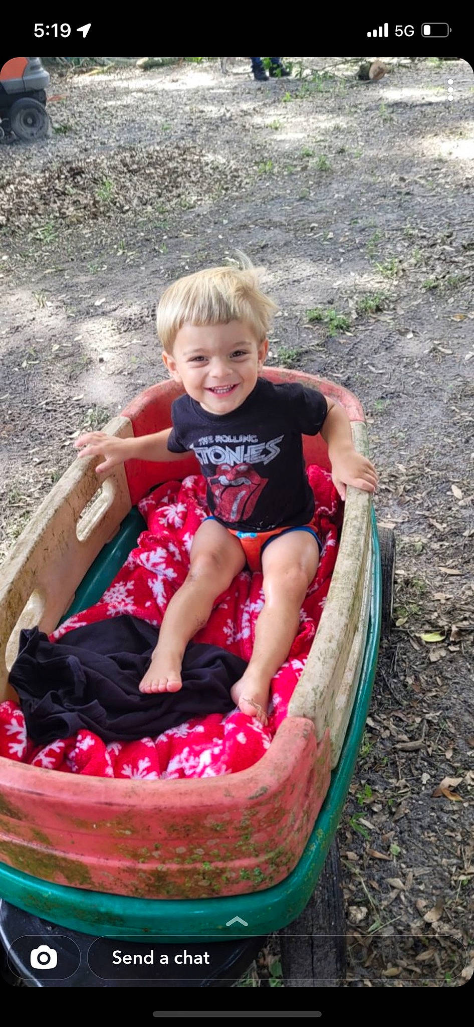 Carson joined the competition — help win amazing prizes! child, face, facial_expression, fun, grass, hair, happy, joy, lap, leisure, mammal, person, plant, recreation, red, shorts, sitting, smile, t_shirt, toddler
