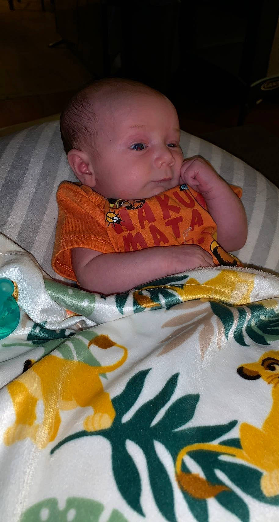 Daylen joined the competition — help win amazing prizes! baby, baby_products, baby_toddler_clothing, chair, cheek, child, comfort, eye, iris, linens, orange, pattern, people, person, product, room, sitting, skin, textile, toddler