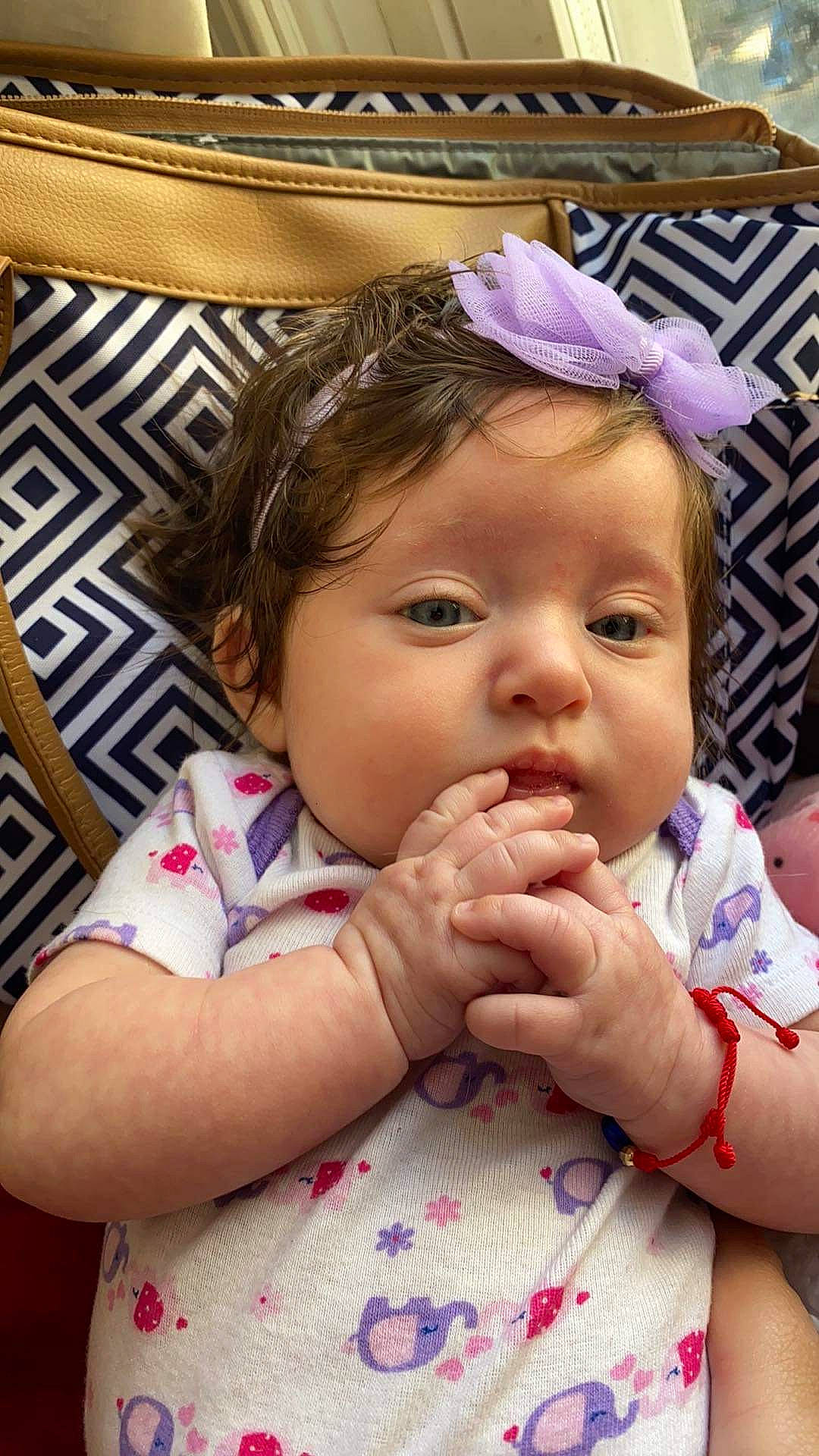 Adrienne is registered to the contest to win money with this photo: arm, baby, baby_toddler_clothing, cheek, chin, clothing, ear, eyebrow, eyelash, fun, gesture, happy, headband, iris, lip, mouth, nose, person, pink, skin