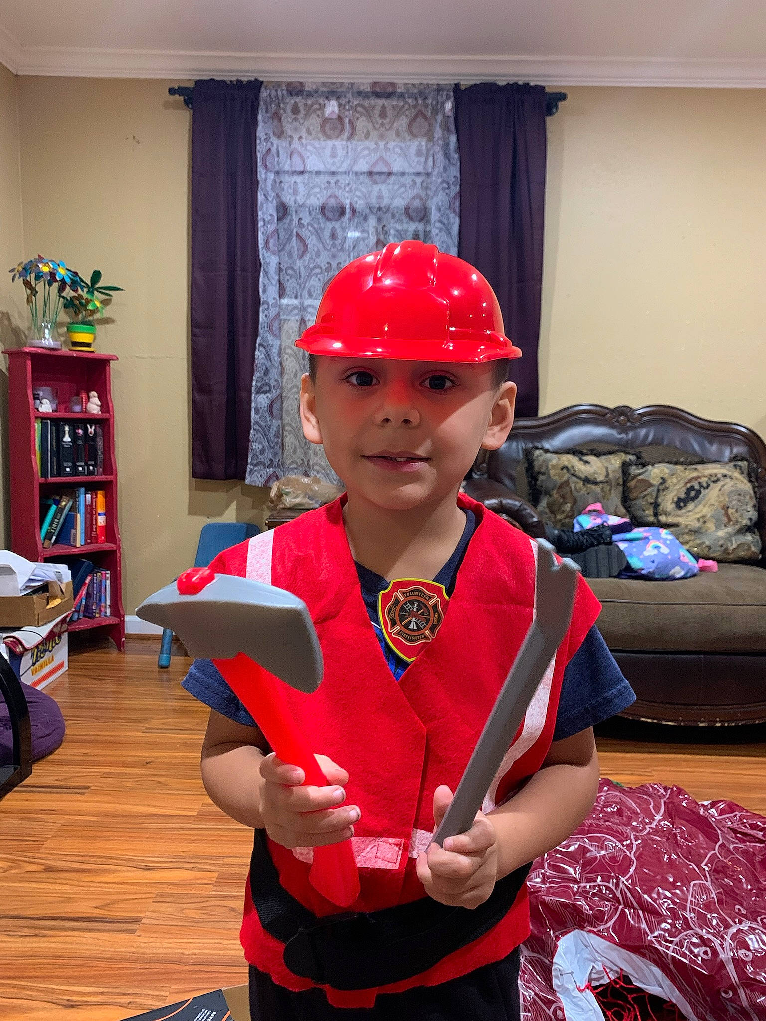 Julien is registered to the contest to win money with this photo: blue, bookcase, cap, carmine, child, costume, curtain, electric_blue, event, eyewear, fashion_accessory, fashion_design, flooring, fun, headwear, joy, person, personal_protective_equipment, room, shelf