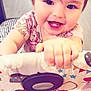 baby, child, smiling, face, hand, teeth, playpen, pattern, clothing, indoor, cute, happy, infant, skin, toy, colorful, person, closeup, young, cheerful