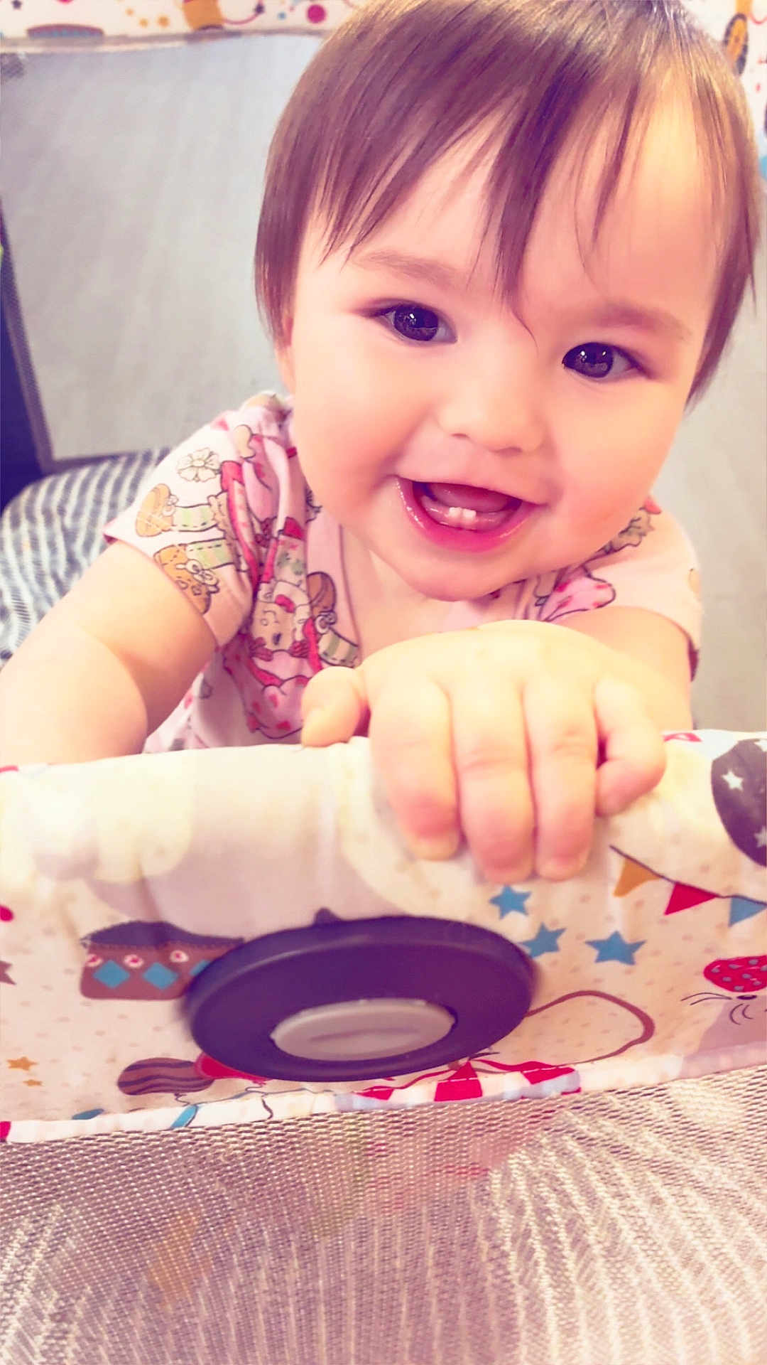 Hazel joined the competition — help win amazing prizes! baby, child, smiling, face, hand, teeth, playpen, pattern, clothing, indoor, cute, happy, infant, skin, toy, colorful, person, closeup, young, cheerful