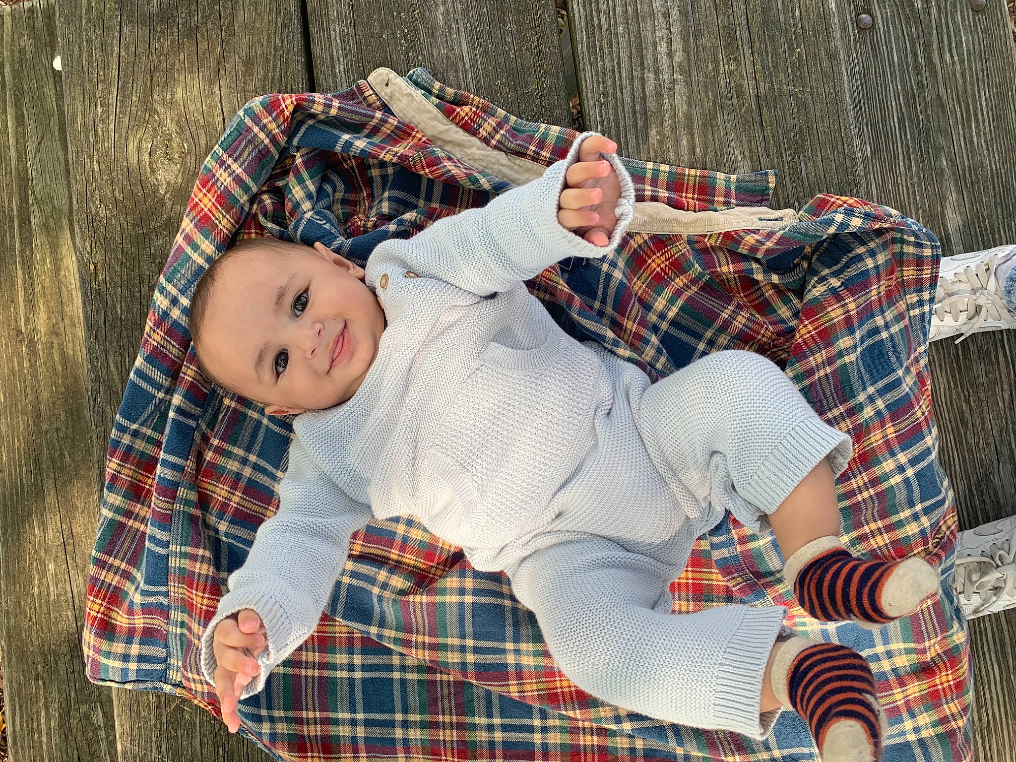 Adam joined the competition — help win amazing prizes! baby, baby_toddler_clothing, child, comfort, face, grass, happy, head, joy, linens, pattern, people_in_nature, person, plaid, sitting, sleeve, tartan, textile, toddler, toy