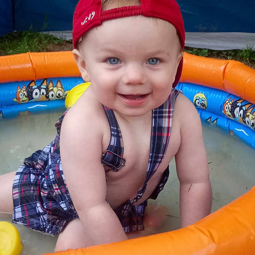 Dominic joined the competition — help win amazing prizes! amusementpark, baby, cap, clothing, face, hat, head, inflatable, lifejacket, outdoors, person, photography, pool, portrait, summer, swimmingpool, swimwear, vest, water, waterpark