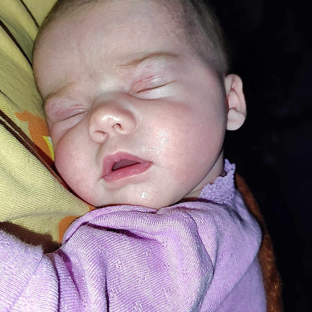 Ellamay joined the competition — help win amazing prizes! baby, blanket, child, closeup, cozy, cute, face, head, indoors, infant, newborn, peaceful, person, pillow, portrait, purple_clothing, resting, skin, sleeping, soft_lighting