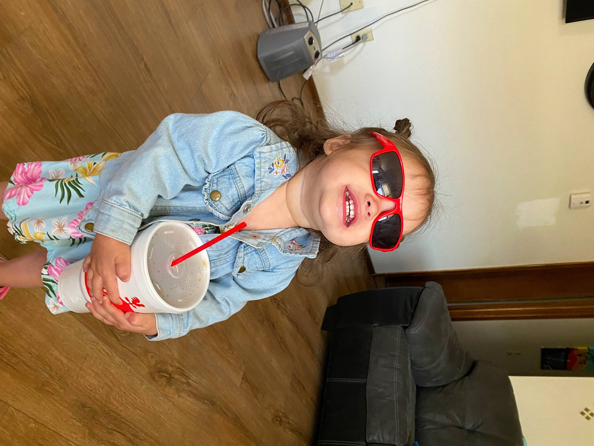 Imani is registered to the contest to win money with this photo: baby, baby_toddler_clothing, carmine, child, comfort, elbow, flooring, fun, happy, hardwood, person, personal_protective_equipment, room, sitting, smile, toddler, wood