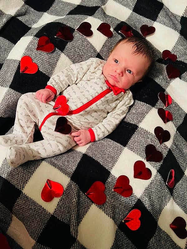 Daxton joined the competition — help win amazing prizes! art, baby, baby_products, baby_toddler_clothing, bed_sheet, bedding, black, child, comfort, floor, flooring, linens, pattern, person, plaid, red, sleeve, tartan, textile, toddler