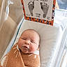 newborn, baby, infant, sleeping, blanket, hospital_bassinet, footprints, card, cozy, wrapped, bed, cute, peaceful, child, person, indoors, soft, hospital, portrait, resting