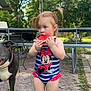 Lakelynn is registered to the contest to win money with this photo: toddler, child, watermelon, swimsuit, minnie_mouse, outdoor, dog, barefoot, brick_patio, greenery, trees, summer, food, snack, cute, playful, person, animal, pet, nature
