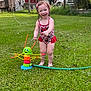 Lakelynn is registered to the contest to win money with this photo: toddler, child, water_sprinkler, swimsuit, red, green_grass, outdoor, summer, play, water, happy, smile, toy, barefoot, fun, sunlight, garden, lawn, cute, nature