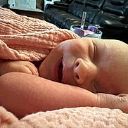 Evelyn Mae joined the competition — help win amazing prizes! baby, sleeping, blanket, pink, closeup, infant, face, hand, cozy, living_room, couch, leather, soft, peaceful, child, rest, comfort, portrait, home, newborn