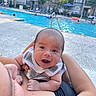 arm, baby, bonding, clothing, daylight, face, happy, holding, infant, leisure, outdoor, parent, person, pool, relaxation, skin, smile, summer, swimming_pool, water