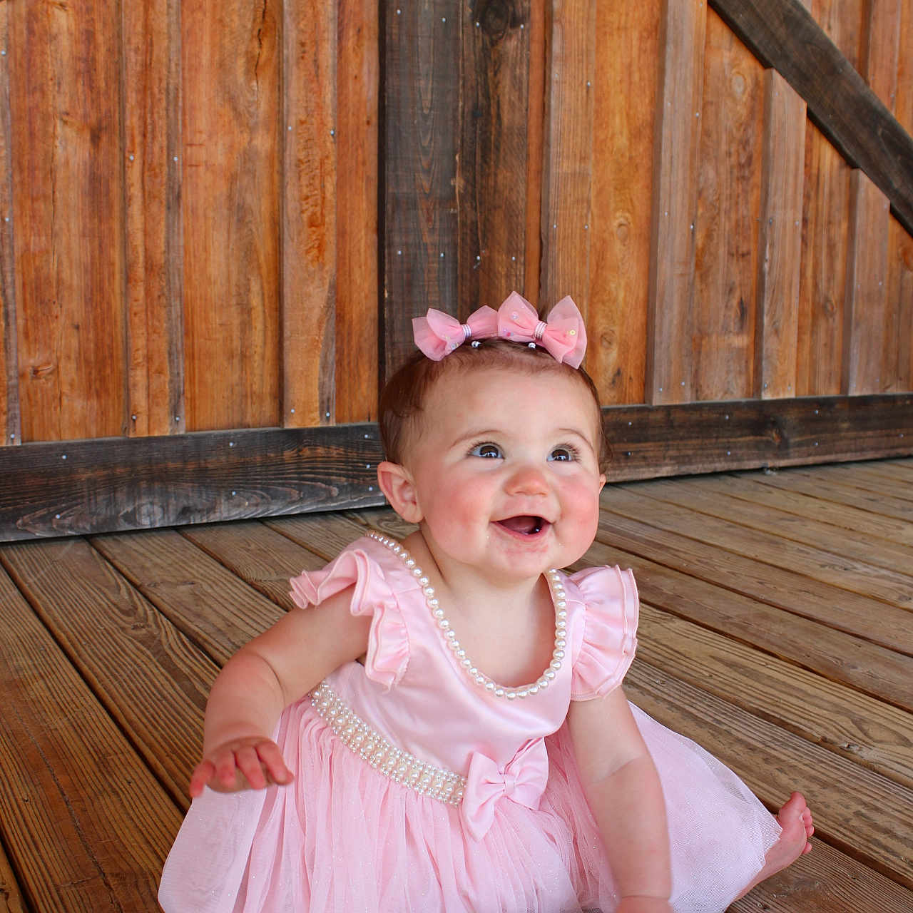Alana Rae is registered to the contest to win money with this photo: accessories, architecture, baby, bodypart, building, clothing, dress, face, finger, hardwood, head, housing, jewelry, necklace, person, photography, plywood, portrait, sitting, wood