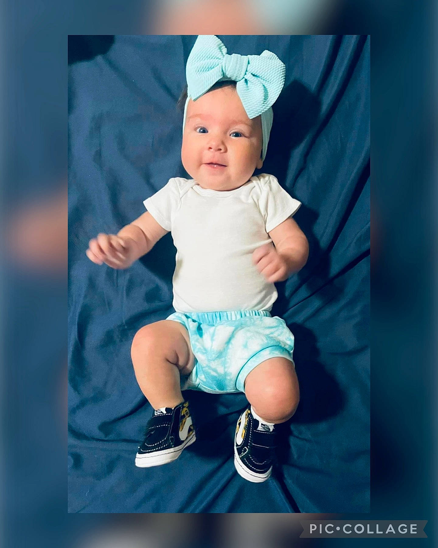 Noel is registered to the contest to win money with this photo: azure, baby, baby_products, baby_toddler_clothing, beanie, cap, child, costume_hat, electric_blue, fashion_accessory, flash_photography, happy, hat, headwear, magenta, pattern, person, shorts, sitting, sleeve