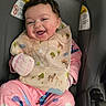 Aria joined the competition — help win amazing prizes! baby, child, smiling, pajamas, bib, car_seat, seatbelt, indoor, happy, face, clothing, infant, cute, person, sitting, pink, gray, animal_print, young, portrait