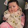 Aria is registered to the contest to win money with this photo: baby, child, infant, car_seat, pink_pajamas, bib, mittens, face, smile, indoor, cute, seated, clothing, person, young_child, expression, head, comfort, funny, adorable