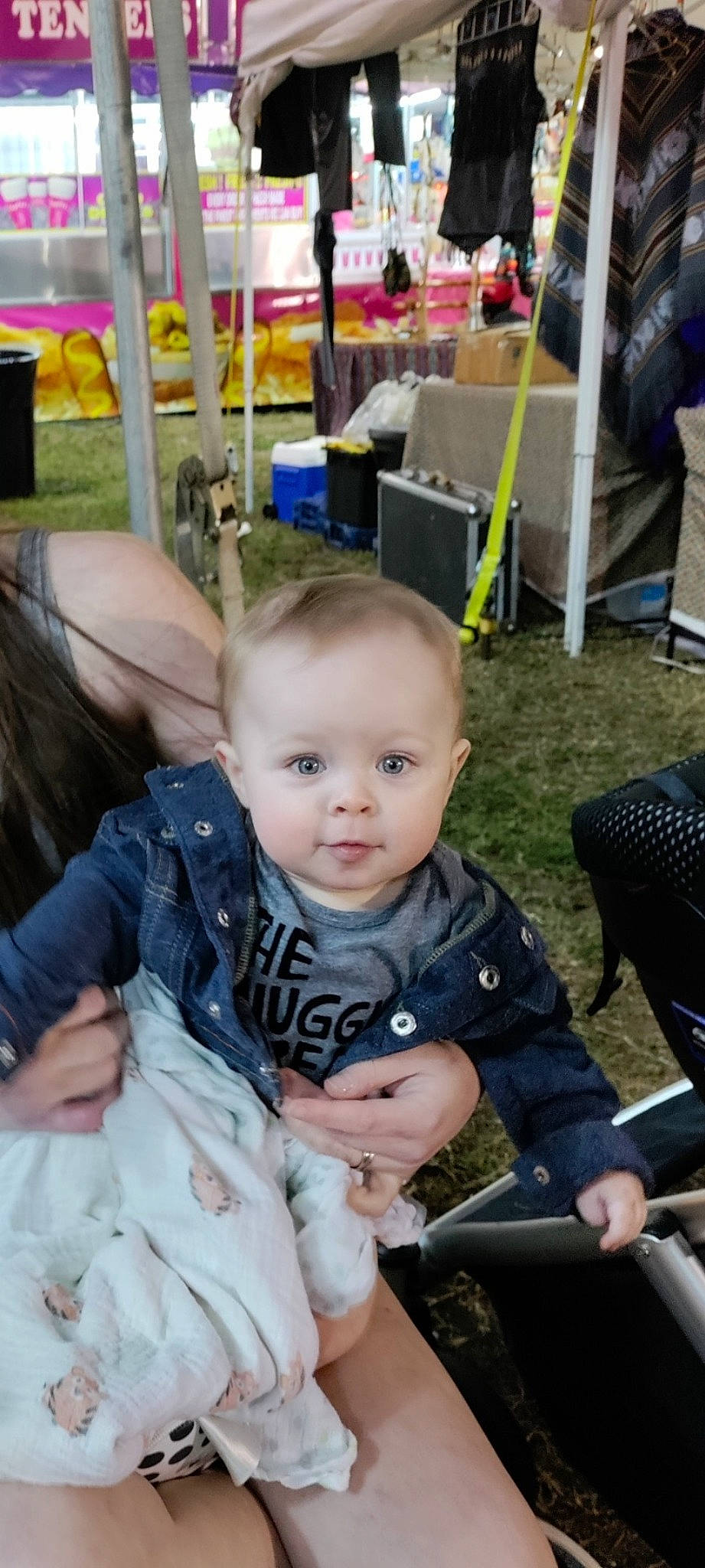 River is registered to the contest to win money with this photo: baby, baby_carriage, baby_products, beauty_salon, chair, child, event, fun, grass, lap, leisure, person, photograph, plant, product, recreation, sitting, skin, snapshot, toddler