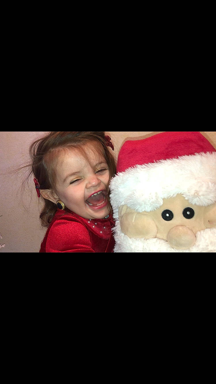 Aleina participe au concours pour gagner de l'argent avec cette photo : baby, christmas, christmas_eve, costume_hat, event, facial_hair, fictional_character, flash_photography, fur, happy, holiday, laugh, magenta, moustache, person, plush, santa_claus, smile, stuffed_toy, toddler