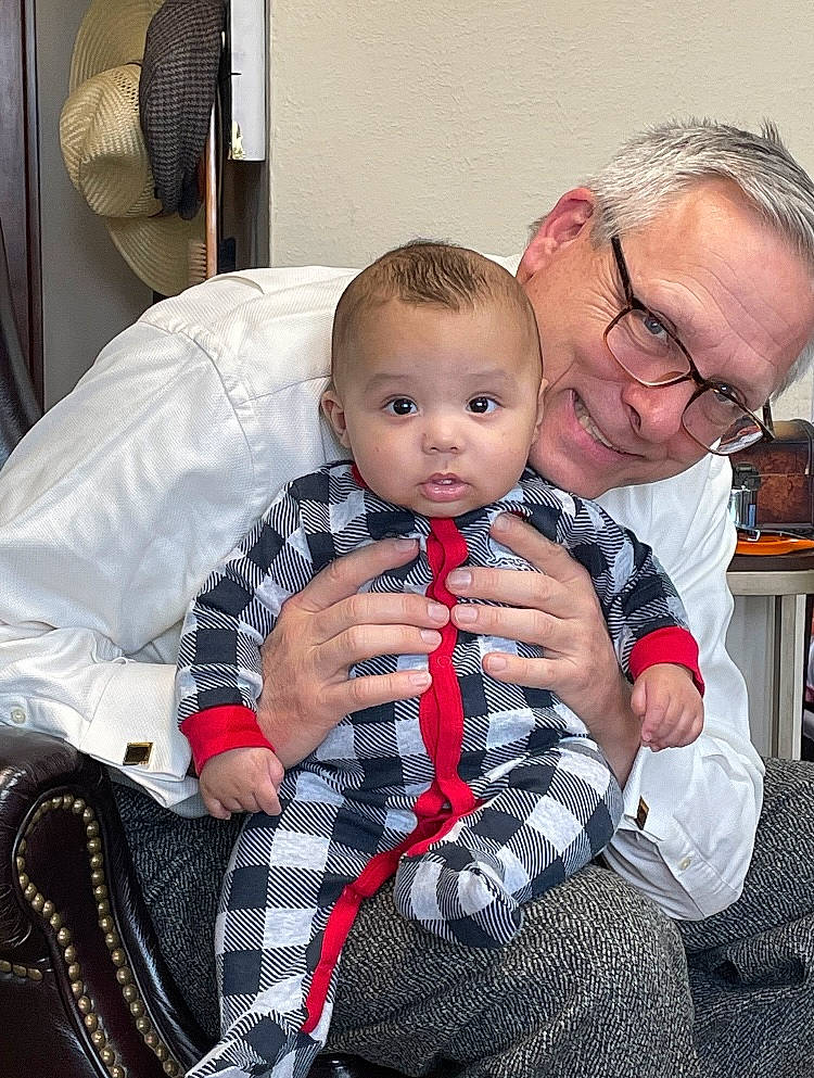 Trenten joined the competition — help win amazing prizes! baby, baby_products, carmine, chair, child, comfort, couch, event, eyewear, gesture, glasses, happy, joy, lap, pattern, person, plaid, room, sitting, smile