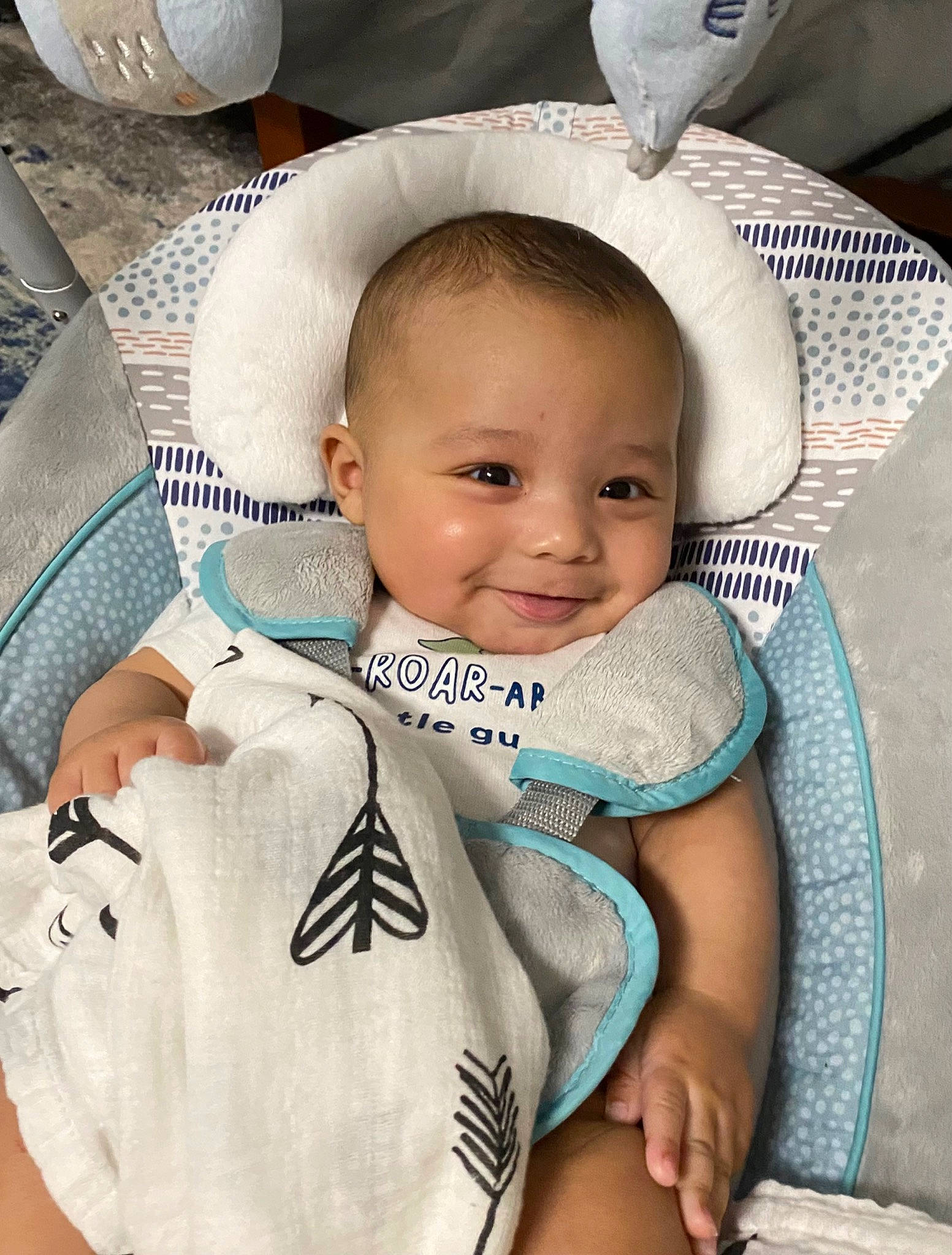 Trenten is registered to the contest to win money with this photo: baby, baby_safety, baby_toddler_clothing, cheek, chest, comfort, eye, eyelash, happy, headgear, human_body, iris, joy, neck, person, skin, sleeve, smile, textile, toddler