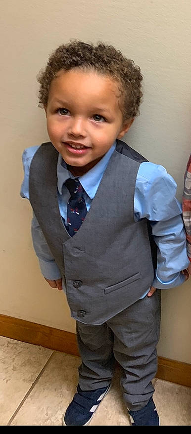 Connor joined the competition — help win amazing prizes! bow_tie, child, child_model, formal_wear, hair, hairstyle, joy, outerwear, person, school_uniform, smile, standing, suit, tie, toddler, tuxedo
