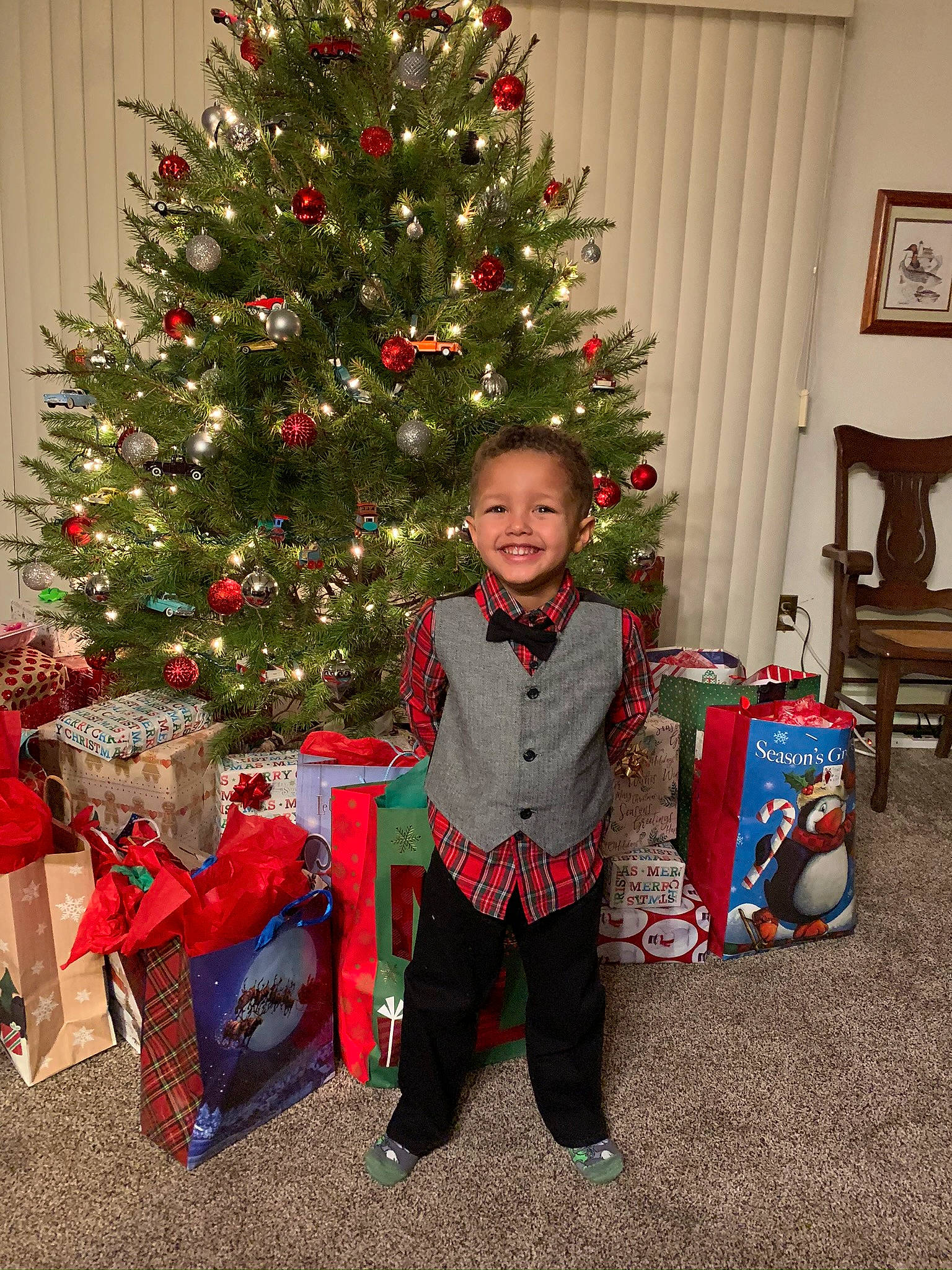 Connor joined the competition — help win amazing prizes! child, christmas, christmas_decoration, christmas_eve, christmas_ornament, christmas_tree, colorado_spruce, conifer, event, fir, holiday, holiday_ornament, home, interior_design, joy, person, pine_family, plant, spruce, standing