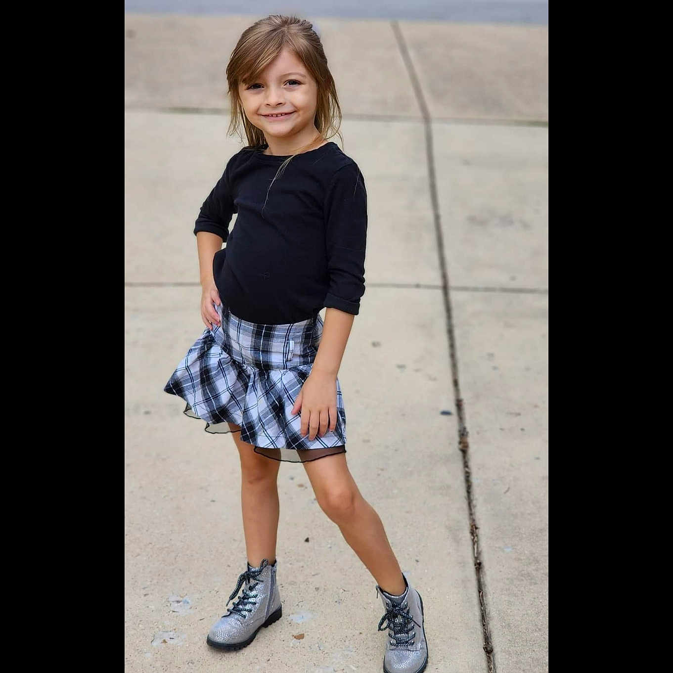 Blaire is registered to the contest to win money with this photo: child, clothing, female, footwear, girl, jeans, kilt, miniskirt, pants, pedestrian, person, shoe, shorts, skirt, sleeve, sneaker, standing, tartan