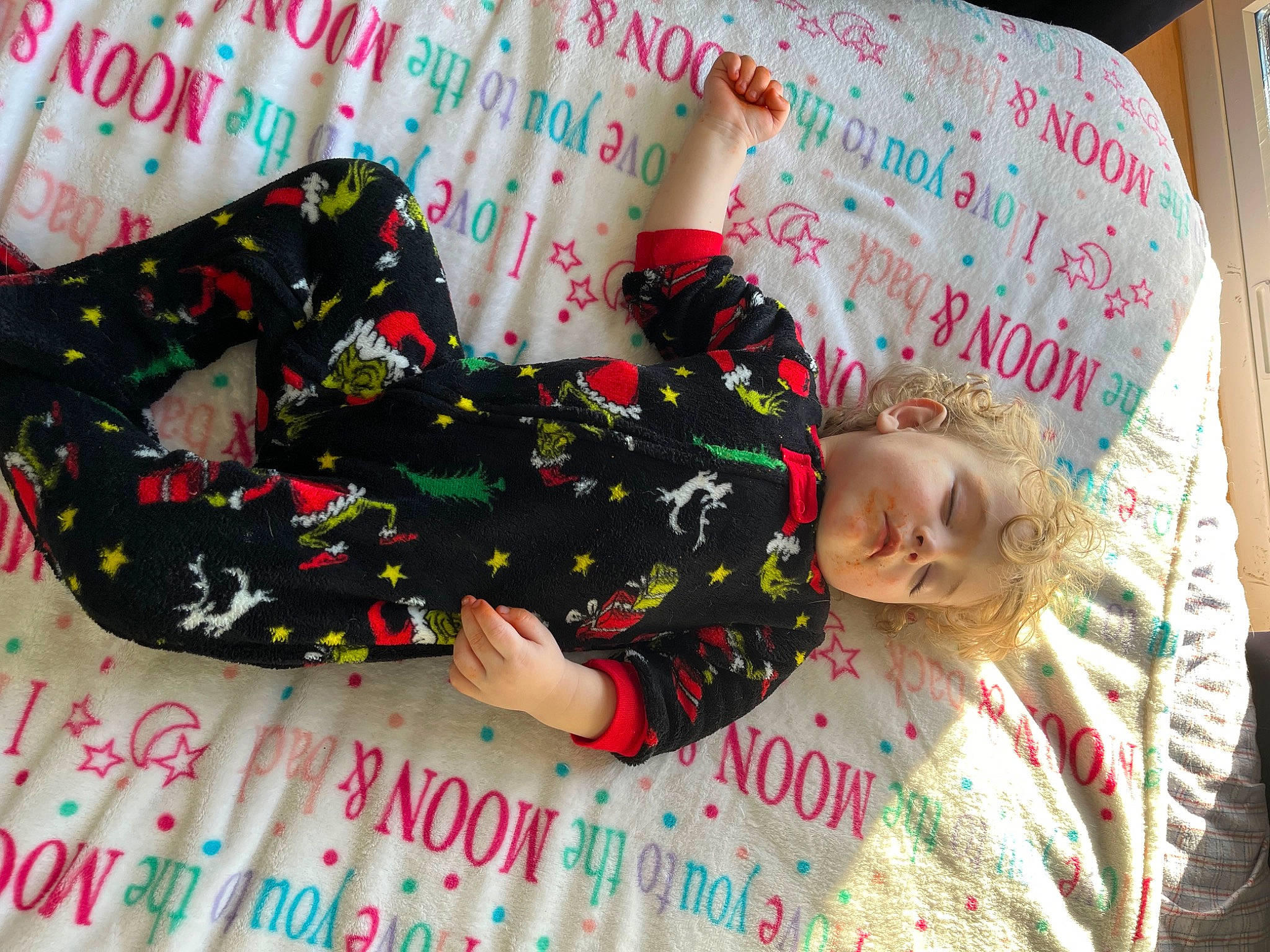 Jaxon is registered to the contest to win money with this photo: baby_toddler_clothing, bedding, child, comfort, font, happy, linens, magenta, mammal, nightwear, pattern, person, pink, product, room, sleeve, sock, textile, toddler