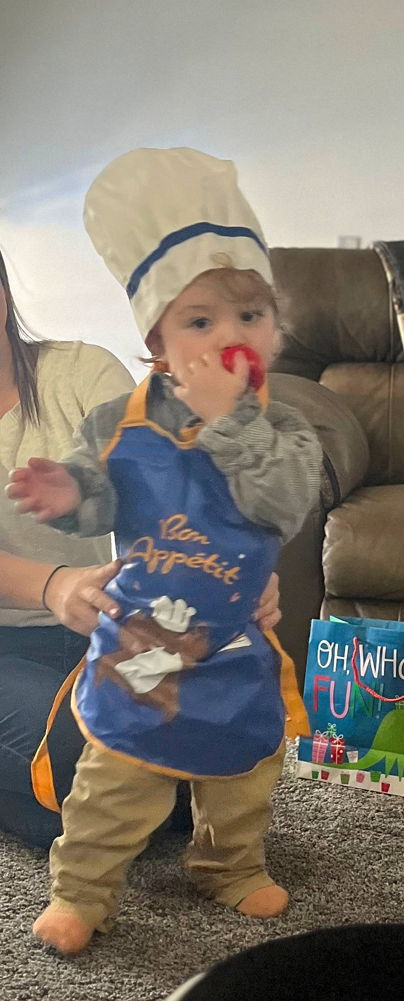 Jaxon is registered to the contest to win money with this photo: baby, cap, child, costume, event, fictional_character, fun, fur, glove, happy, headgear, headwear, person, play, recreation, sitting, t_shirt, toddler, vacation