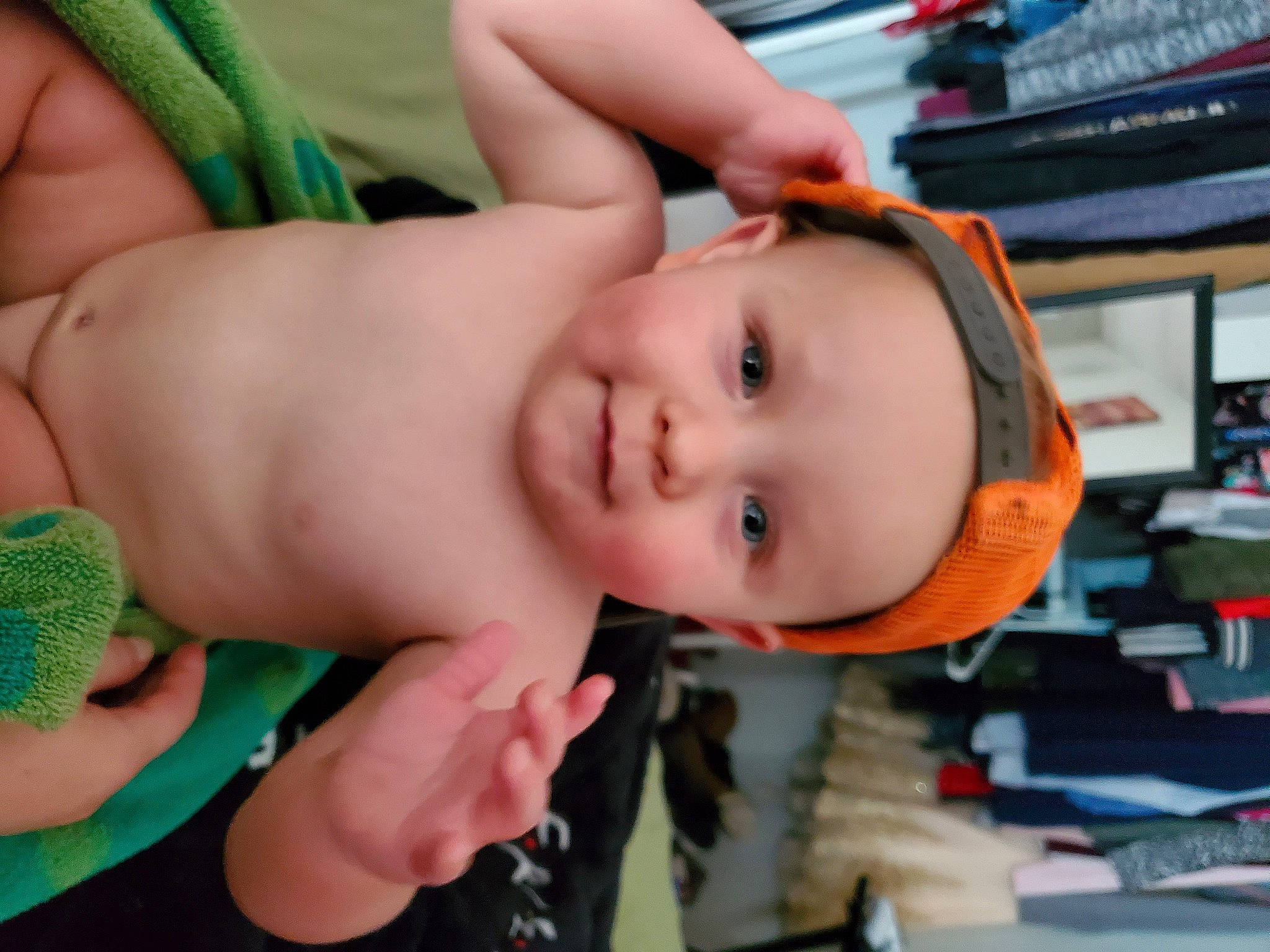 Zayne is registered to the contest to win money with this photo: abdomen, arm, baby, cheek, chest, eyebrow, eyelash, finger, fun, hand, happy, headwear, joy, lip, mouth, nose, person, shelf, skin, smile