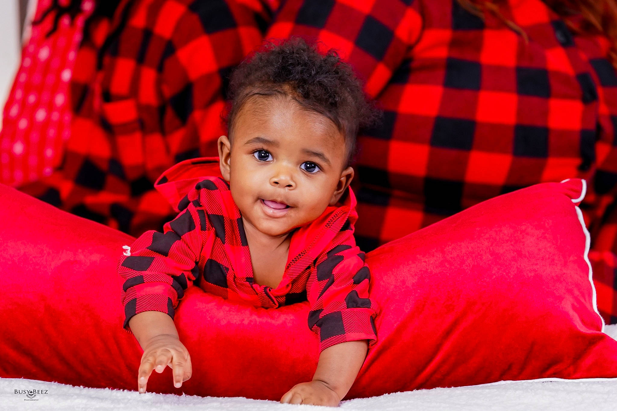 Jace is registered to the contest to win money with this photo: baby, baby_toddler_clothing, child, comfort, eye, flash_photography, fun, grass, happy, head, leisure, person, pink, plaid, red, skin, sleeve, smile, tartan, textile