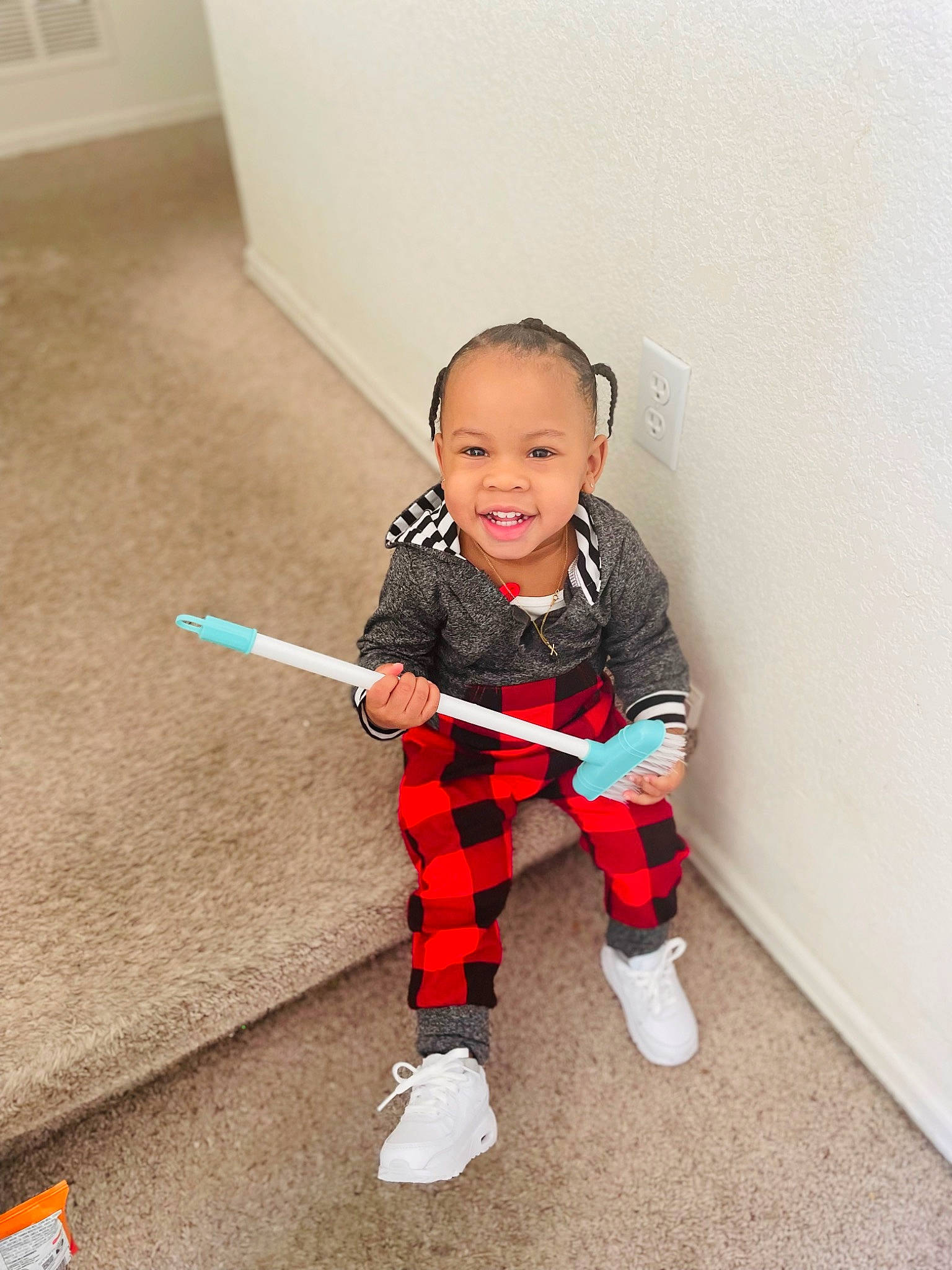 Jamier is registered to the contest to win money with this photo: baby, baby_toddler_clothing, carmine, child, clothing, costume, floor, flooring, happy, human_leg, joy, knee, pattern, person, plaid, sleeve, smile, sock, t_shirt, tartan