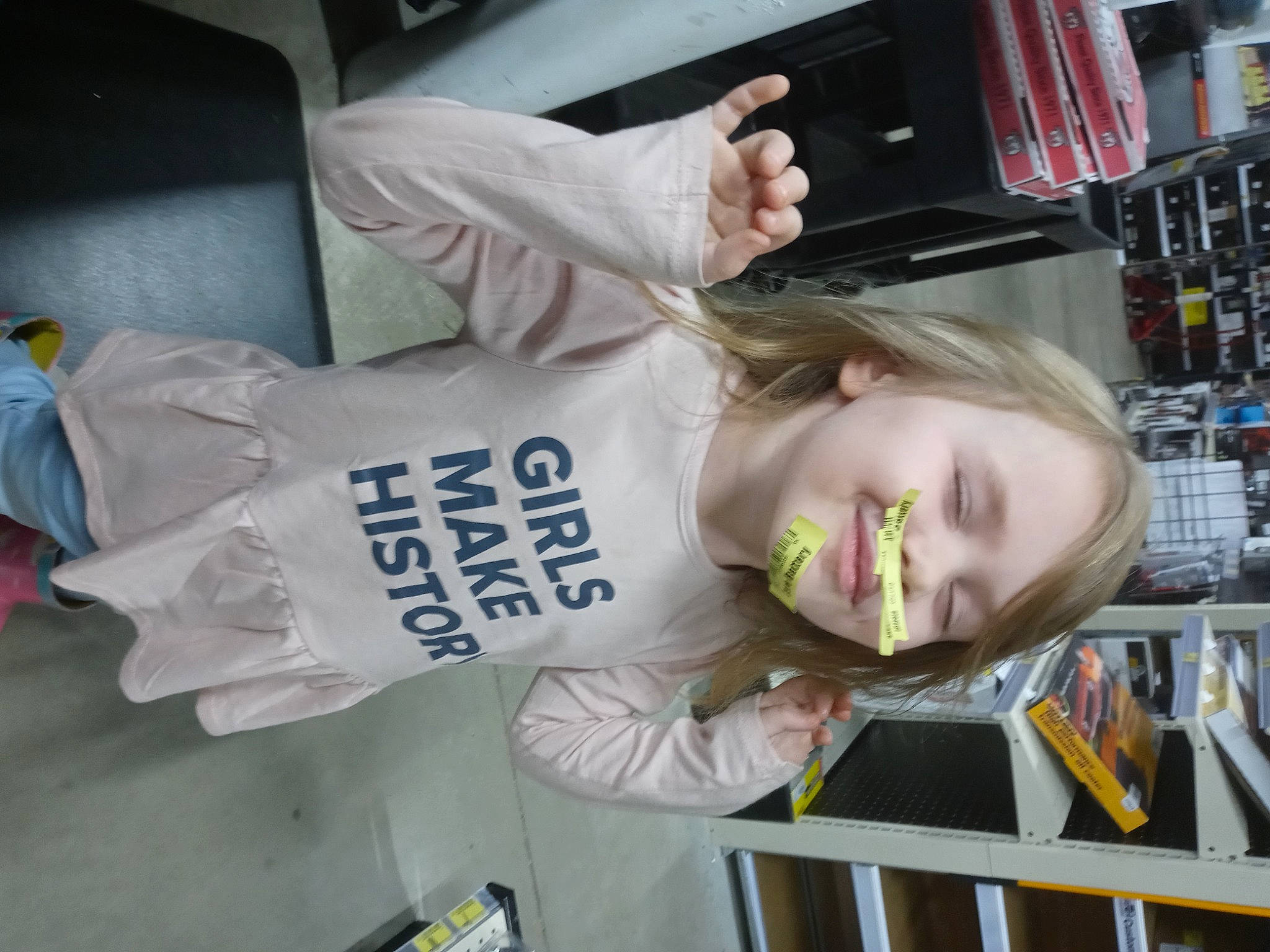 Alexandria joined the competition — help win amazing prizes! child, elbow, fun, gesture, hair_coloring, human_leg, joy, person, room, shelf, sleeve, smile, sportswear, t_shirt