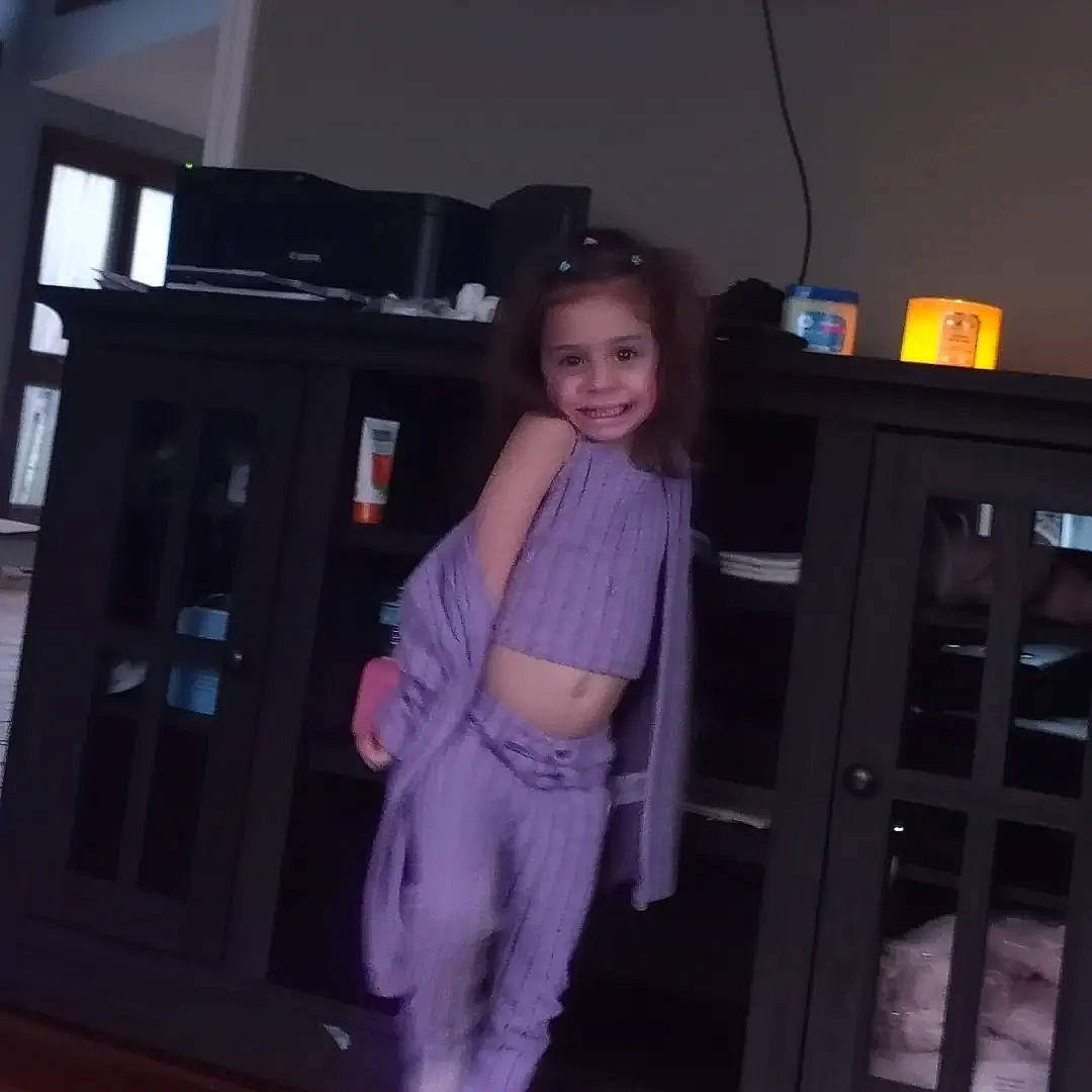 Sofia joined the competition — help win amazing prizes! door, flooring, fun, hardwood, human_leg, joy, knee, long_hair, magenta, person, purple, sleeve, smile, standing, sweatpant, t_shirt, thigh, thumb, toddler, trunk