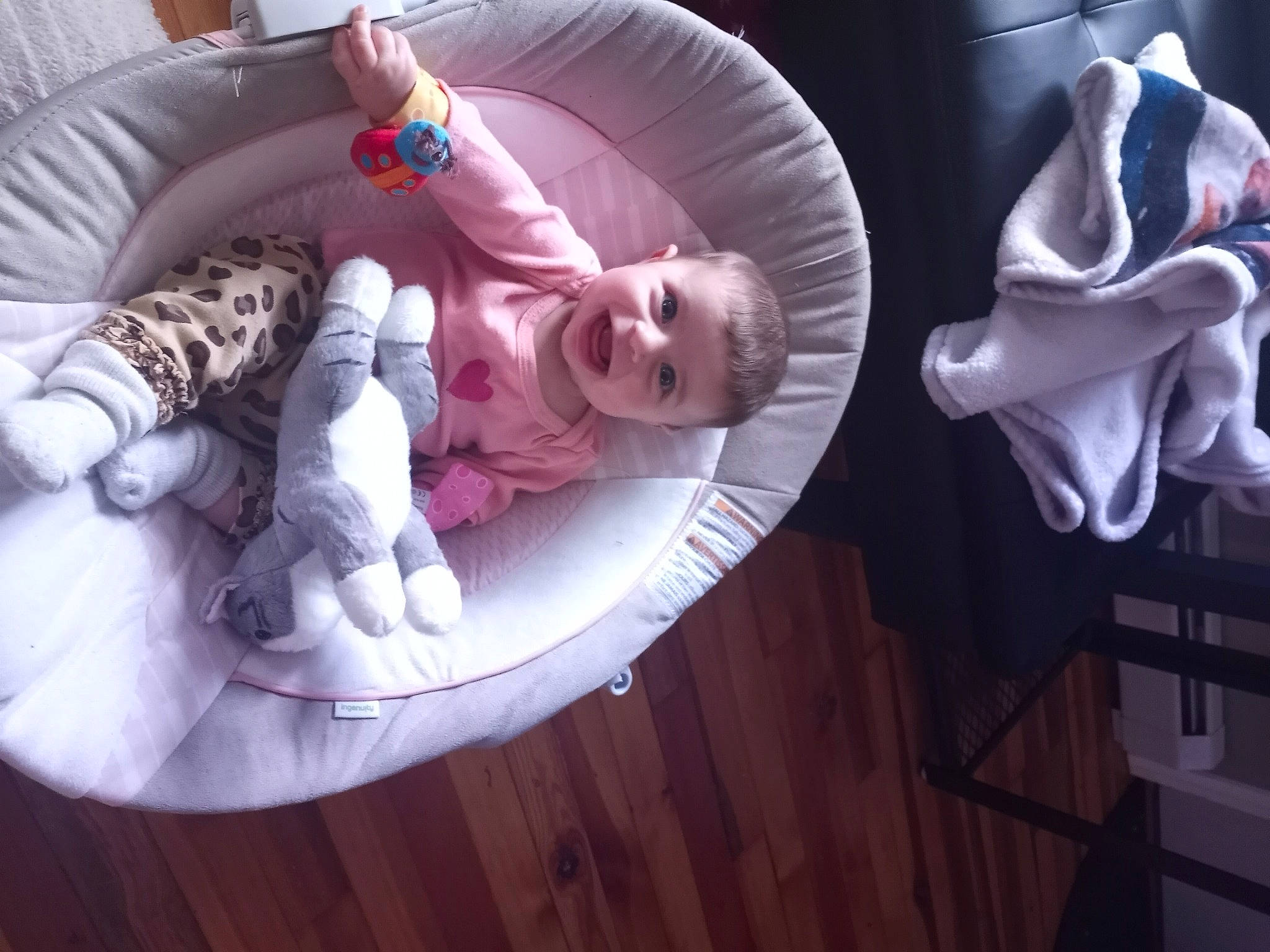 Hayley is registered to the contest to win money with this photo: baby, baby_products, baby_safety, baby_toddler_clothing, baby_toys, carmine, child, circle, comfort, eye, fun, hardwood, human_body, linens, magenta, person, purple, room, sitting, toddler