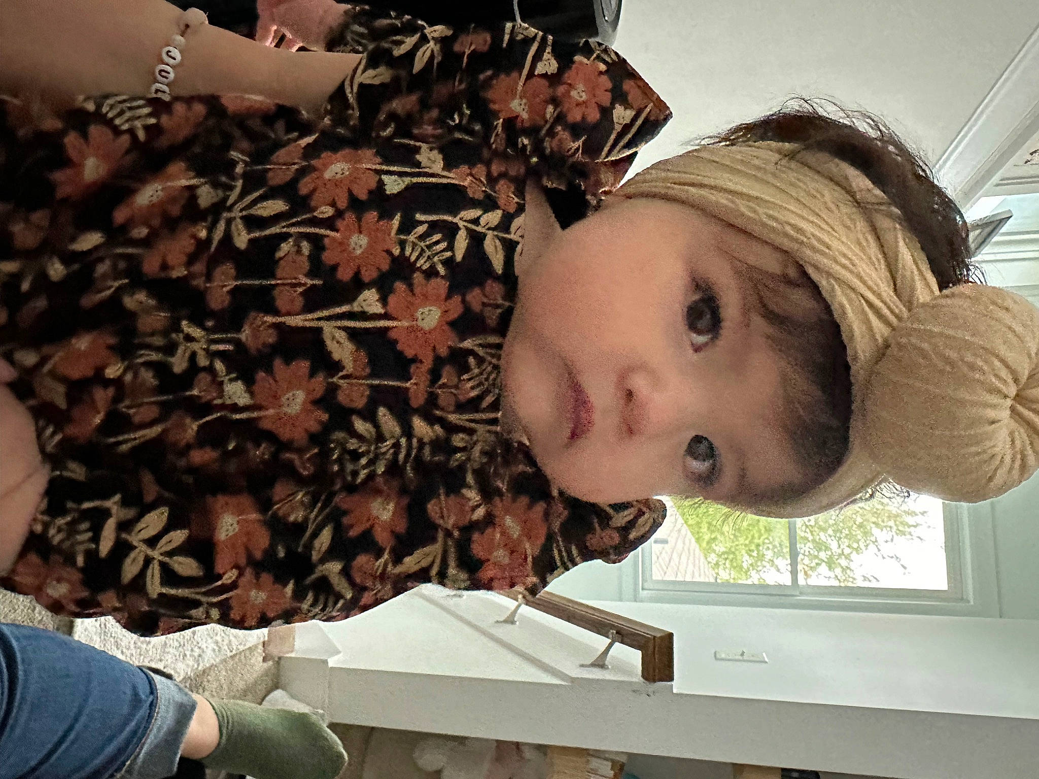 Julianna is registered to the contest to win money with this photo: arm, brown_hair, child, clothing, eyelash, fashion_accessory, fashion_design, fun, happy, long_hair, nose, pattern, person, plant, selfie, skin, t_shirt, toddler, tree, window