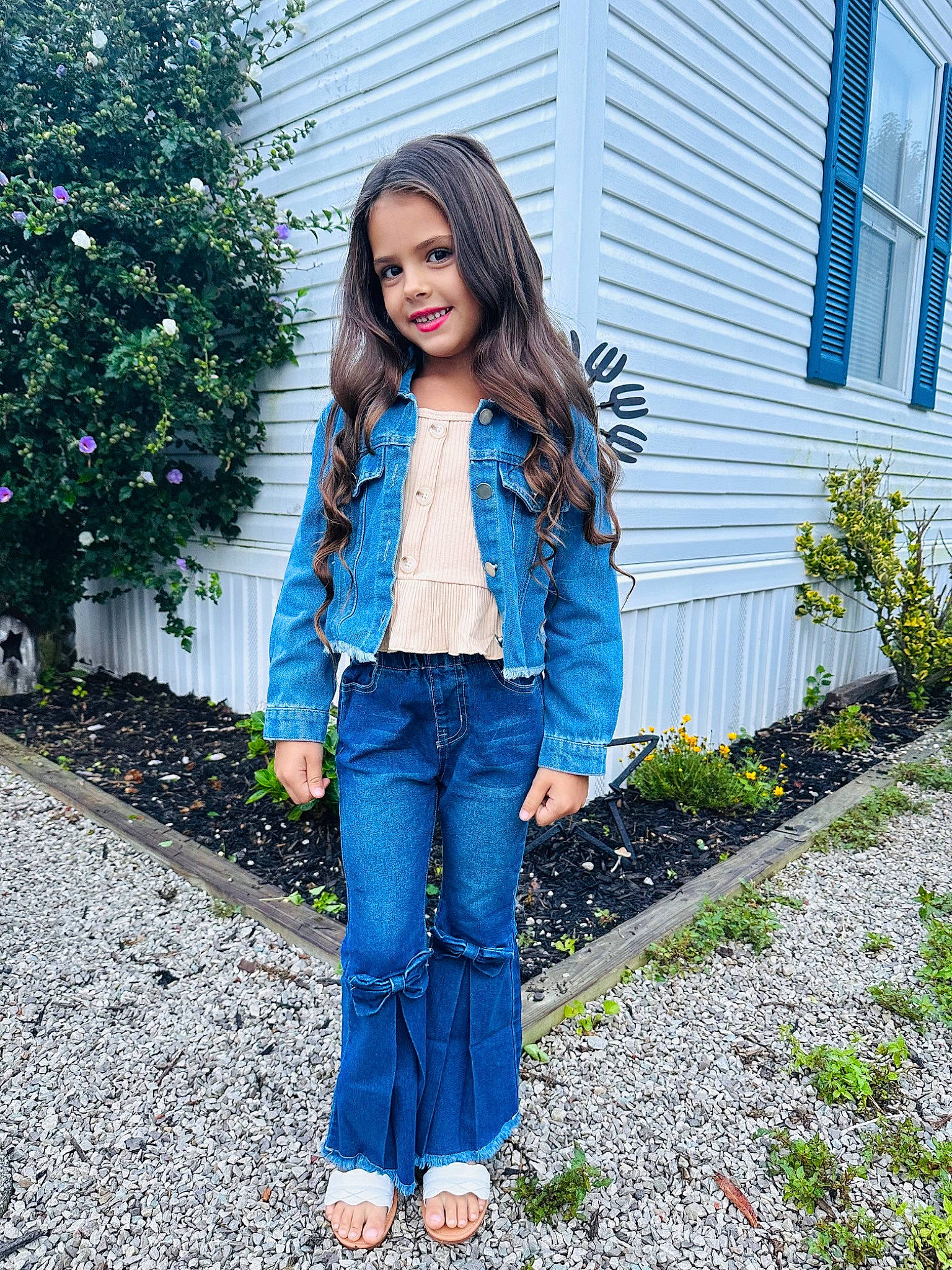 Sadie is registered to the contest to win money with this photo: blazer, blue, brown_hair, denim, electric_blue, eyewear, fashion_accessory, grass, jeans, joy, leather_jacket, leisure, long_hair, magenta, pattern, person, plaid, plant, shoulder, sleeve