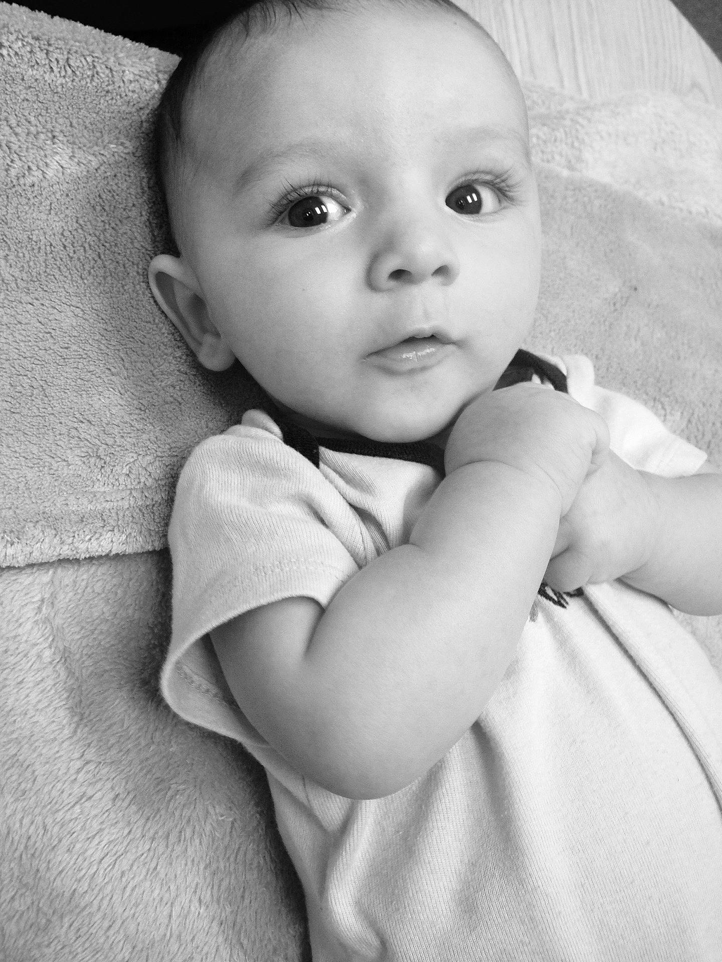 Aiden joined the competition — help win amazing prizes! beauty, black, black_and_white, cheek, child, eye, face, girl, head, infant, monochrome, monochrome_photography, nose, person, photograph, photography, skin, smile, standing, white