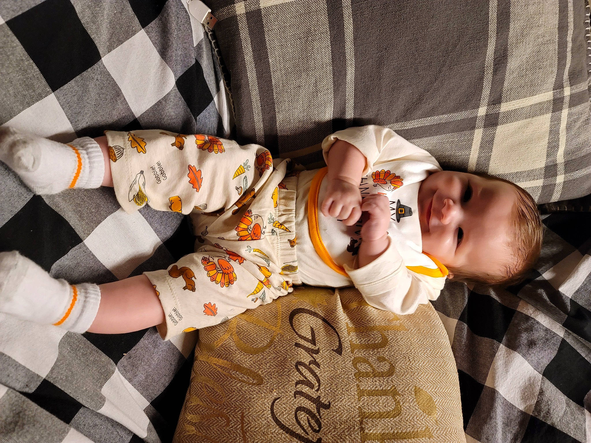 Parker joined the competition — help win amazing prizes! baby, baby_products, baby_toddler_clothing, bedtime, child, comfort, finger, fun, happy, linens, nap, orange, pattern, person, plaid, sitting, sleep, sleeve, tartan, textile