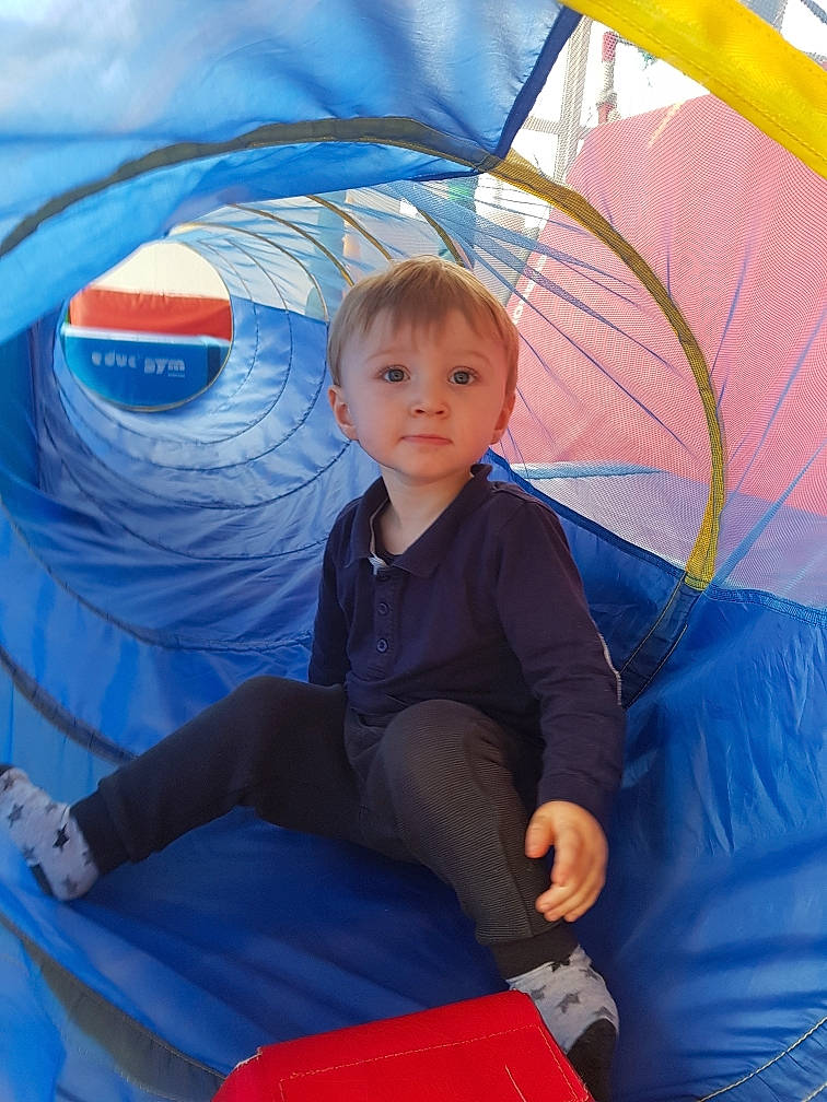 Matthew participe au concours pour gagner de l'argent avec cette photo : azure, blue, camping, child, comfort, electric_blue, fashion_accessory, fun, leisure, outdoor_recreation, person, recreation, shade, sitting, snapshot, tarpaulin, tent, tints_and_shades, toddler, umbrella